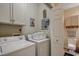 Convenient laundry room with washer, dryer and storage cabinets, providing a practical space at 4865 Luster Leaf Circle # 402, Myrtle Beach, SC 29577