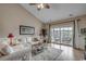 Bright living room with high ceilings and sliding glass doors to a screened porch with great views at 4865 Luster Leaf Circle # 402, Myrtle Beach, SC 29577