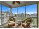 Screened in porch with comfortable seating and beautiful views of the surrounding community at 4865 Luster Leaf Circle # 402, Myrtle Beach, SC 29577