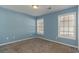 Neutral bedroom with natural light from two large windows at 505 Hay Hill Ln. # B, Myrtle Beach, SC 29579