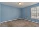 Bedroom bathed in light with a large window at 505 Hay Hill Ln. # B, Myrtle Beach, SC 29579