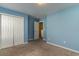 Bedroom with blue walls, closet, and doorway at 505 Hay Hill Ln. # B, Myrtle Beach, SC 29579