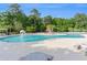 Large community swimming pool with a splash fountain and surrounding lounge chairs, perfect for summer relaxation at 505 Hay Hill Ln. # B, Myrtle Beach, SC 29579
