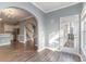 Open concept living room with wood floors, archways and a glass door leading to the exterior at 505 Hay Hill Ln. # B, Myrtle Beach, SC 29579