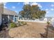 Expansive backyard with a charming white fence surrounding a well-manicured lawn and an outdoor patio area at 509 Hillsborough Dr., Conway, SC 29526