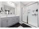Bathroom features double sink vanity and a glass-enclosed shower with white subway tile at 509 Hillsborough Dr., Conway, SC 29526