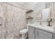 Bright bathroom featuring a vanity with a modern sink, a large mirror, and a patterned shower curtain at 509 Hillsborough Dr., Conway, SC 29526