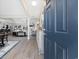 Welcoming entryway with wood flooring, decorative cabinet, and a glimpse into the living spaces at 509 Hillsborough Dr., Conway, SC 29526