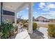 Inviting front porch featuring decorative plants, a welcome mat, and attractive landscaping at 509 Hillsborough Dr., Conway, SC 29526