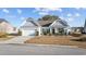 Charming single-story home featuring a well-manicured lawn, attached garage, and inviting curb appeal at 509 Hillsborough Dr., Conway, SC 29526