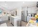 Bright kitchen boasts stainless steel appliances and an island with white countertops at 509 Hillsborough Dr., Conway, SC 29526