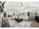Spacious living room featuring hardwood floors, comfortable seating, and seamless flow to dining area at 509 Hillsborough Dr., Conway, SC 29526