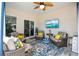 Comfortable covered patio with cozy seating, a ceiling fan, and a mounted television at 509 Hillsborough Dr., Conway, SC 29526
