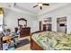 Primary bedroom with tray ceiling, wood furniture, tv, open doorway to kitchen at 514 Hillsborough Dr., Conway, SC 29526