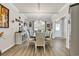 Formal dining area with coffered ceiling, modern chandelier, wainscoting and large window with bright natural light at 514 Hillsborough Dr., Conway, SC 29526