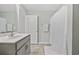 Well-lit bathroom features a modern vanity and a shower with a curtain at 517 Antebellum Ln., Georgetown, SC 29440