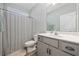 Clean bathroom featuring hardwood floors, a vanity, a shower with a curtain, and great lighting at 517 Antebellum Ln., Georgetown, SC 29440