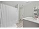 Clean bathroom features a functional vanity, shower, and linen shelving unit at 517 Antebellum Ln., Georgetown, SC 29440