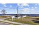 Exterior of a waterfront home with a private pier and large covered porch at 517 Antebellum Ln., Georgetown, SC 29440