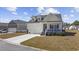 Charming single-Gathering home with a front porch, white siding, and a well-kept lawn with a concrete driveway at 517 Antebellum Ln., Georgetown, SC 29440