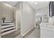Inviting hallway with wood floors leads to the living area and staircase at 517 Antebellum Ln., Georgetown, SC 29440