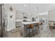 Modern kitchen featuring gray cabinets, stainless steel appliances, a large island, and pendant lighting for a gourmet feel at 517 Antebellum Ln., Georgetown, SC 29440