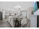 Open-concept living area with modern gray tones, wood floors, and ample natural light, blending style with comfort at 517 Antebellum Ln., Georgetown, SC 29440