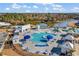 Aerial view of the community pool and recreation area with a pond at 546 Calhoun Falls Dr., Myrtle Beach, SC 29577