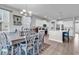 Charming dining area with a rustic table, elegant chairs, and a view to the modern kitchen at 546 Calhoun Falls Dr., Myrtle Beach, SC 29577