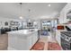 Open-concept kitchen with a large island, modern appliances, and seamless flow to the dining and living areas at 546 Calhoun Falls Dr., Myrtle Beach, SC 29577
