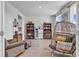 Cozy living room featuring bookshelves, a comfortable chair, and a decorative hanging chair at 546 Calhoun Falls Dr., Myrtle Beach, SC 29577