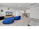 Carpeted upstairs loft featuring a TV and two comfortable oversized beanbag chairs at 546 Calhoun Falls Dr., Myrtle Beach, SC 29577