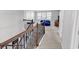 Upstairs loft with staircase, carpet, and bright natural light from windows at 546 Calhoun Falls Dr., Myrtle Beach, SC 29577