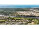 An aerial view showcases the community, golf course, waterway, shopping, and ocean in the distance at 5801 Oyster Catcher Dr. # 1623, North Myrtle Beach, SC 29582