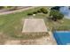 Outdoor basketball court alongside a pond with landscaping at 5801 Oyster Catcher Dr. # 1623, North Myrtle Beach, SC 29582