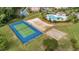 Aerial of community tennis court, volleyball court, and basketball court near pool at 5801 Oyster Catcher Dr. # 1623, North Myrtle Beach, SC 29582