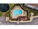Overhead view of a community pool, with ample lounging, manicured landscaping and parking at 5801 Oyster Catcher Dr. # 1623, North Myrtle Beach, SC 29582