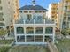 View of a modern condo building with beach access and multiple floors of balconies at 5801 Oyster Catcher Dr. # 1623, North Myrtle Beach, SC 29582