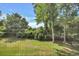 Lush outdoor landscaping with mature trees and lawn at 5801 Oyster Catcher Dr. # 1623, North Myrtle Beach, SC 29582