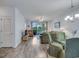 A view of the living room with glass table and access to screened porch at 5801 Oyster Catcher Dr. # 1623, North Myrtle Beach, SC 29582