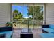 Relaxing screened porch with comfortable seating and a view of the surrounding greenery at 5801 Oyster Catcher Dr. # 1623, North Myrtle Beach, SC 29582