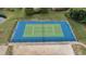 Aerial view of a well-maintained community tennis court surrounded by a fence at 5801 Oyster Catcher Dr. # 1623, North Myrtle Beach, SC 29582