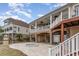 The backyard features a hot tub and covered patio, ideal for enjoying the outdoor space at 601 Tradewind Ct., North Myrtle Beach, SC 29582