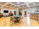 Spacious basement with coffered ceilings, stone pillar, kitchenette, and game table offers ample entertainment space at 601 Tradewind Ct., North Myrtle Beach, SC 29582