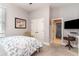 Relaxing bedroom with blue and white bedding, a ceiling fan, neutral paint, and a window for natural light at 601 Tradewind Ct., North Myrtle Beach, SC 29582