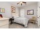 Comfortable bedroom with artwork, a neutral color scheme, a ceiling fan, and a window with blinds at 601 Tradewind Ct., North Myrtle Beach, SC 29582