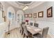 Dining room with modern chandelier and a wood table with seating for six at 601 Tradewind Ct., North Myrtle Beach, SC 29582
