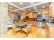 Spacious kitchen with light wood cabinetry, stainless steel appliances, a coffered ceiling, and stone accents at 601 Tradewind Ct., North Myrtle Beach, SC 29582
