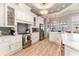 Well-equipped kitchen features stainless appliances, shaker cabinets, and stylish backsplash at 601 Tradewind Ct., North Myrtle Beach, SC 29582
