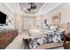 Main bedroom features tray ceilings, ample natural light, and neutral decor at 601 Tradewind Ct., North Myrtle Beach, SC 29582